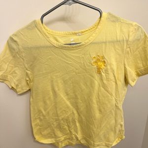 Yellow cropped t-shirt.